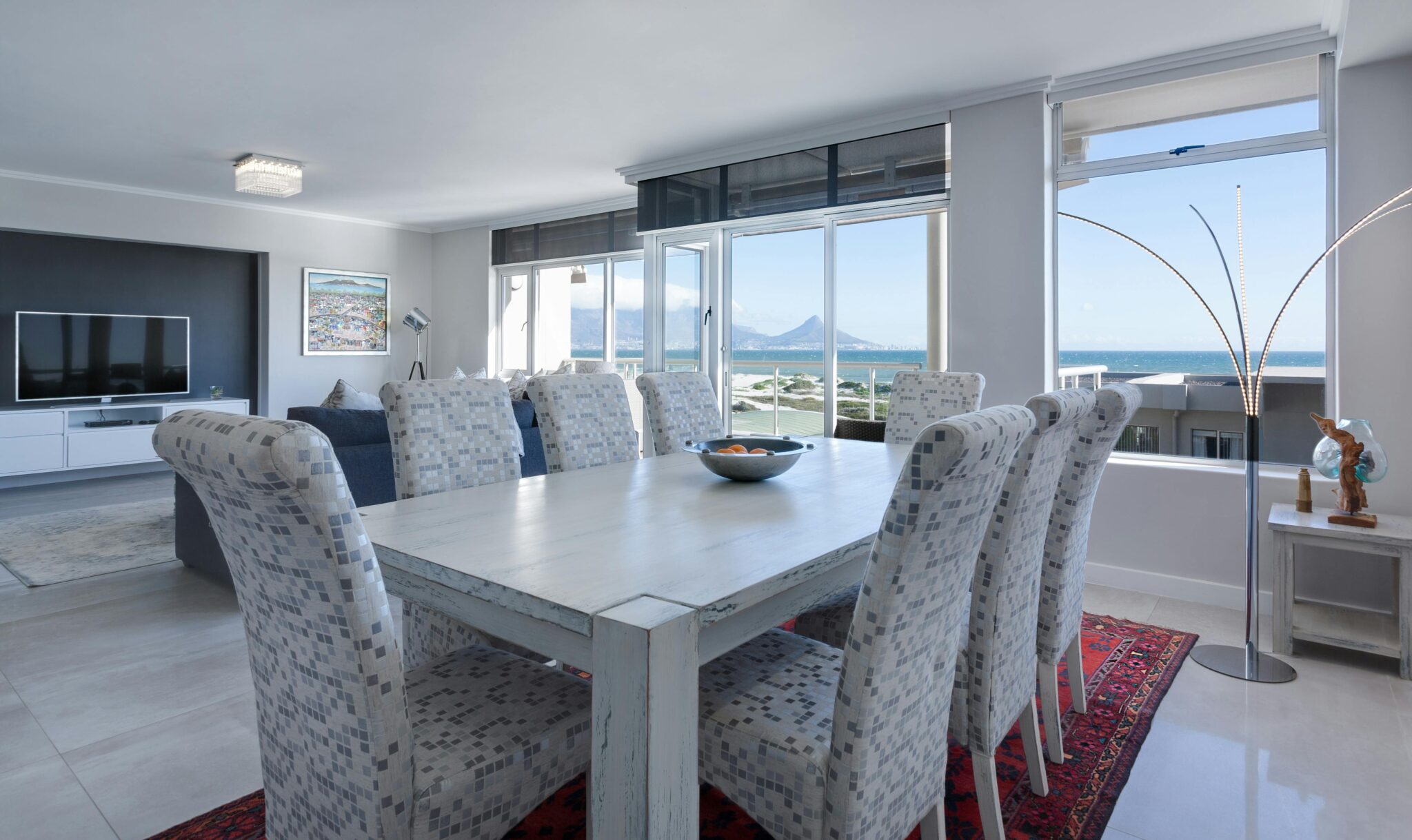 Luxurious dining room in Cape Town with modern furniture and ocean views.